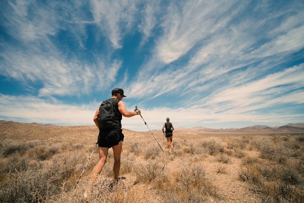 Two men running through Death Valley National Monument